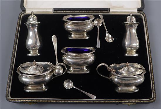 A cased George V silver six piece condiment set by Synyer & Beddoes.